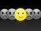 Cheerful positive and sad emoticons on dark background.