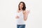 Cheerful pregnant woman showing okay gesture.