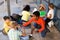 Cheerful preteens resting outdoors in schoolyard during break