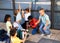 Cheerful preteens resting outdoors in schoolyard during break