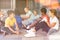 Cheerful preteens resting outdoors in schoolyard during break