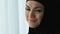 Cheerful pretty arab female in hijab smiling, female wellness and happiness