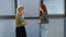 Cheerful professional female manager handshaking of client or customer making business deal at office meeting on