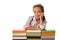 cheerful pupil smiling while looking at camera near colorful books isolated on white.