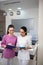 Cheerful receptionists feeling good while working together