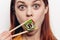 cheerful red-haired woman chopsticks sushi japanese cuisine