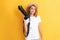 cheerful redhead woman photographer with camera in straw hat making photo, cameraman