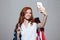 Cheerful redhead young lady with USA flag make selfie