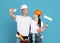 Cheerful Repair Workers Couple In Protective Hard Hats Taking Selfie On Smartphone