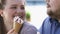 Cheerful romantic couple of obese people having fun and eating ice-cream on date