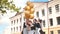 Cheerful Russian girls graduating with orange balloons on the last school day.