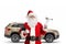 Cheerful santa claus holding car repair tools