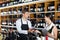 Cheerful seller man giving sample taste of wine