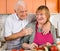 Cheerful senior couple cooking