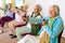 Cheerful senior women exercising their arms