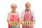 Cheerful seniors offering freshly baked pies