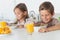 Cheerful siblings eating cereal together