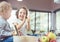 Cheerful siblings making a dessert