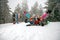 Cheerful skiers lying on snow and having fun