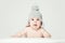 Cheerful small baby in knitted hat, portrait