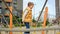 Cheerful smiling boy playing and rocking on the swing with ropes and nets. Active child, sports and development, kids playing