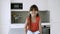 Cheerful smiling little girl sitting on kitchen counter