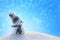 Cheerful snowman in profile on a snowy slope. Beautiful Christmas background