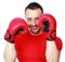Cheerful sportsman in boxing gloves