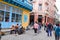 Cheerful street musicians playing on a street outdoors and people seeing it  Cuba