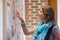 Cheerful student pointing at notice board