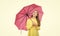 cheerful teen child hold pink parasol. kid in hat with pink umbrella. autumn season.