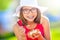 Cheerful teenage girl with dental braces glasses and ice cream. Portrait of a smiling pretty young girl in summer outfit with ice