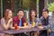 Cheerful teenagers laughing together in restaurant