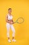 cheerful tennis player in sportswear with racket on yellow background, athlete