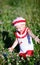 Cheerful toddler girl in meadow