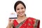 Cheerful traditional Indian woman holding a credit card