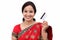 Cheerful traditional Indian woman holding a credit card