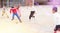 Cheerful tween schoolchildren playing with ball near school