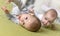 Cheerful twins on the bed