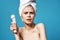 cheerful woman with bare shoulders with a massager in her hands cosmetology dermatology