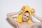 cheerful woman with bare shoulders with a yellow towel on her head orange vitamin freshness