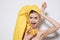 cheerful woman with bare shoulders with a yellow towel on her head orange vitamin freshness