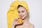 cheerful woman with bare shoulders with a yellow towel on her head orange vitamin freshness