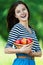 Cheerful woman basket apples