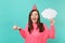 Cheerful woman in birthday hat screaming, hold cake with candle, empty blank Say cloud, speech bubble for promotional