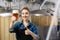 Cheerful woman brewer with glass of beer