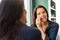 Cheerful woman cleaning face cotton pads bathroom