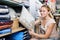 Cheerful woman customer picking fluffy pillow