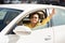 Cheerful Woman Driving Auto Gesturing Thumbs-Up Having Ride In City