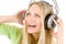 Cheerful woman with headphones listen to music